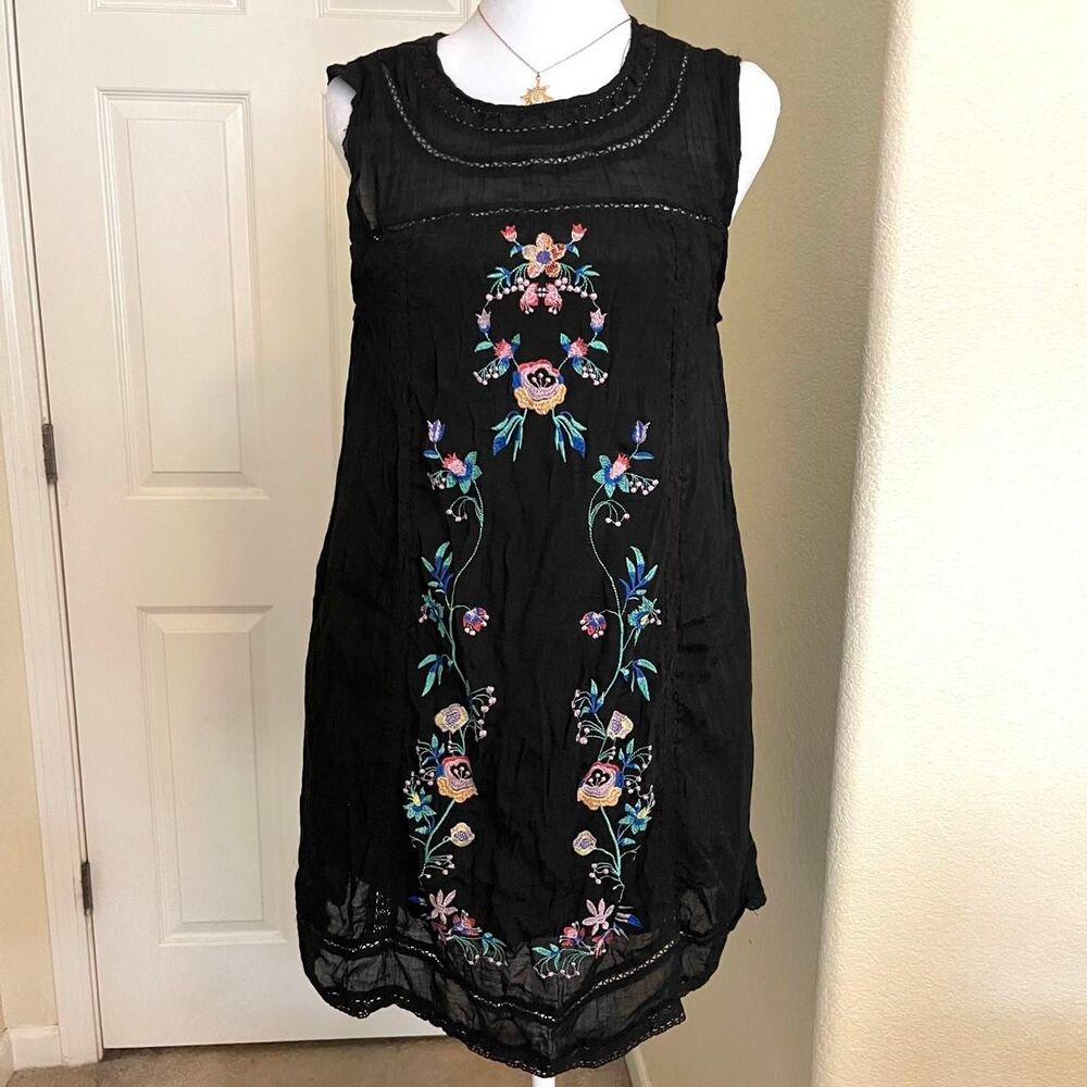 Black embroidered floral dress with pink, blue, and green flowers and leaves